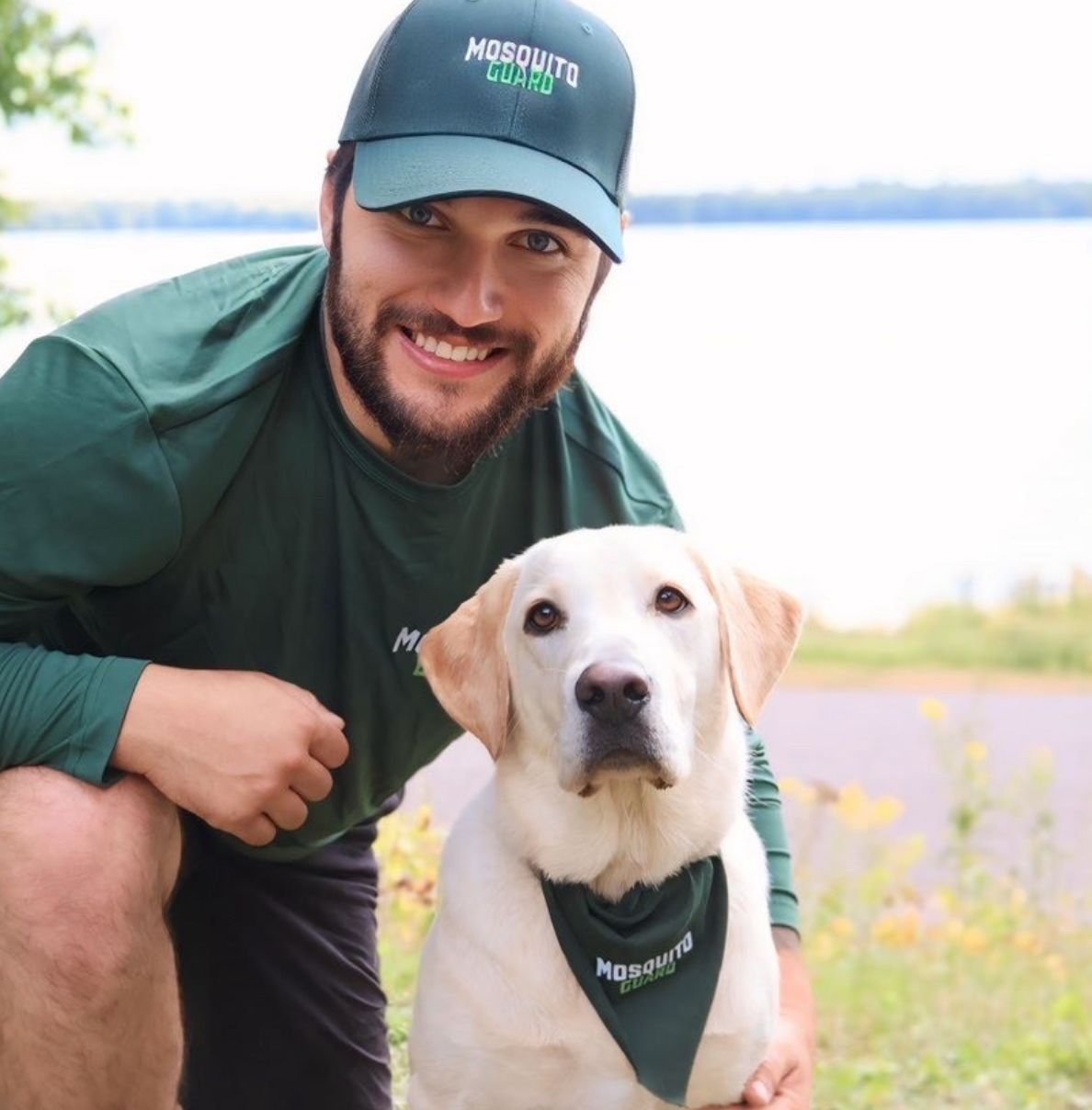 Owner of Mosquito Guard Wisconsin with family dog on a Northwoods property
